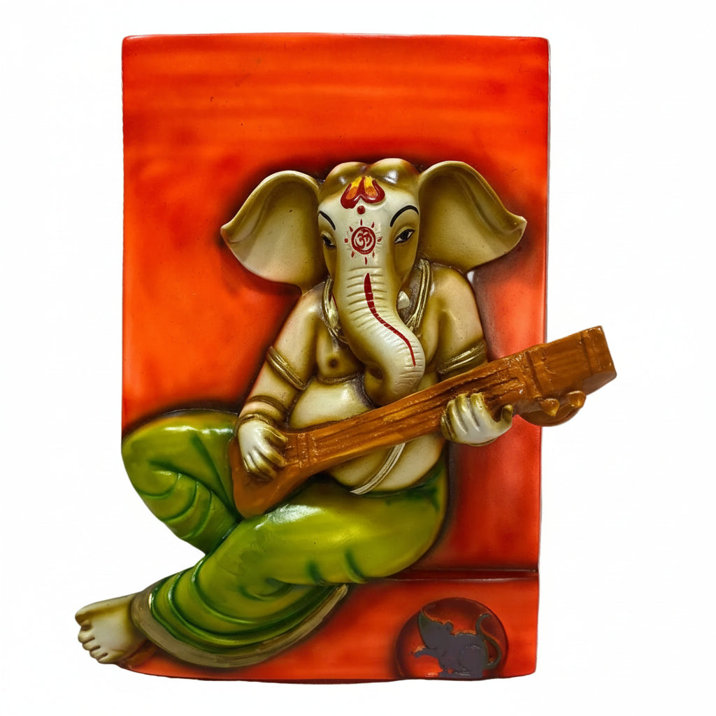 A wall-mounted resin sculpture of Lord Ganesha, the elephant-headed god, playing a musical instrument, in colors predominantly orange, green, and multicolor.