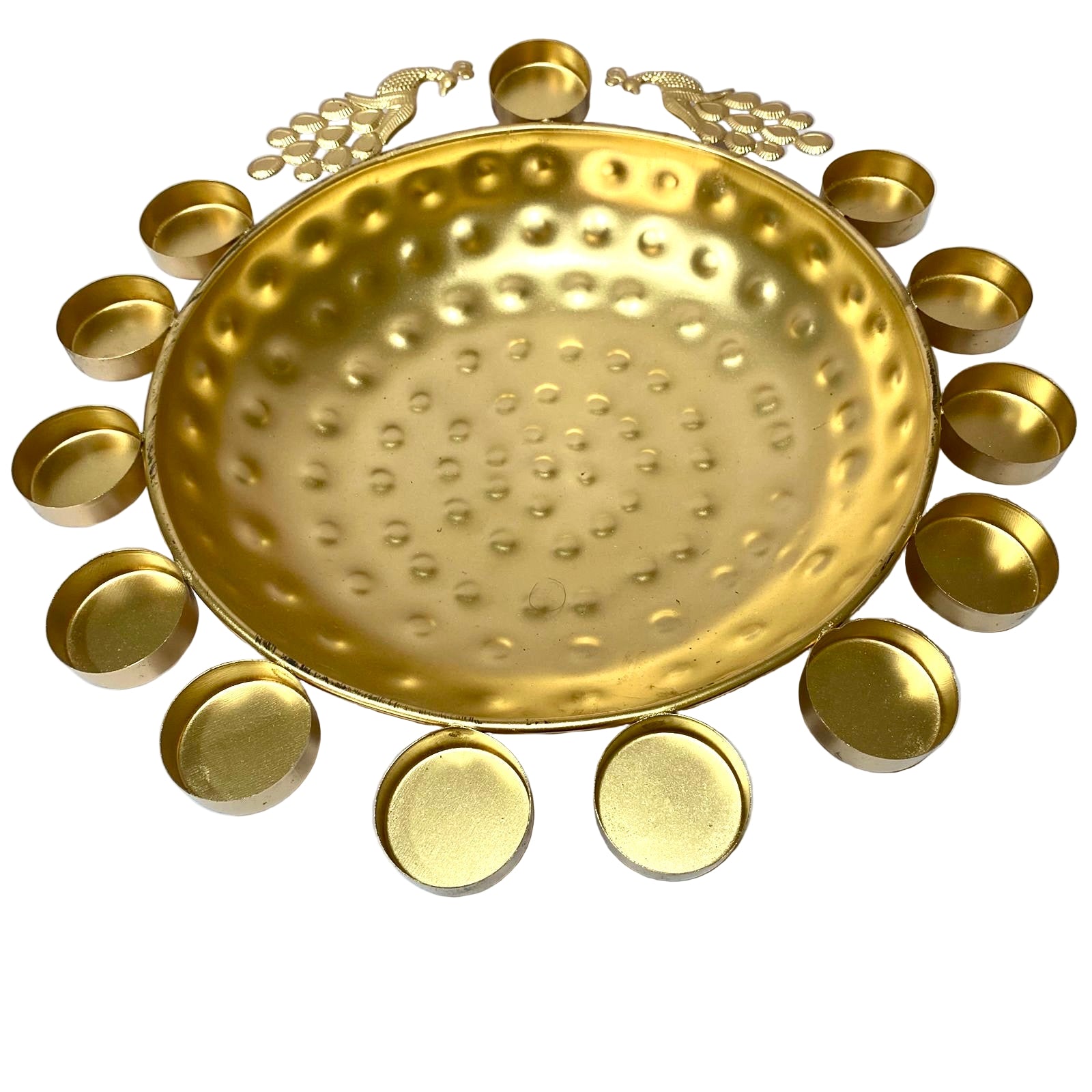 Decorative gold plate with embossed design surrounded by smaller gold dishes on a white background