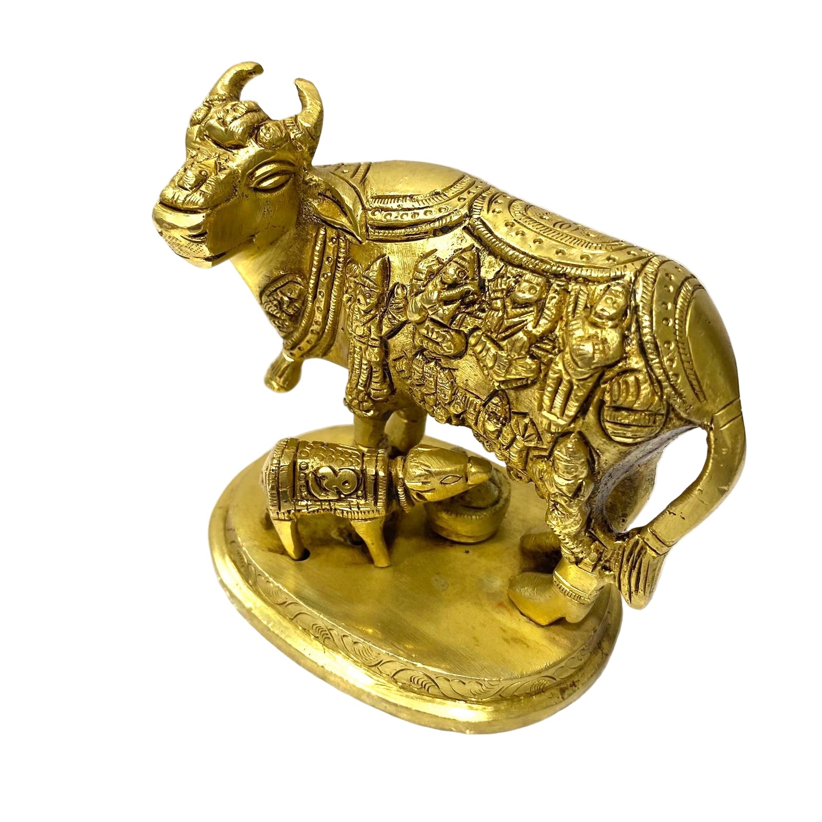 Brass statue of a bull with intricate designs on a white background