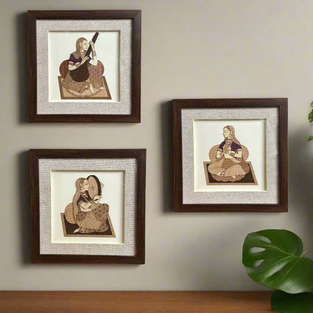 Set of three framed artworks of a seated figure with a guitar on a white background