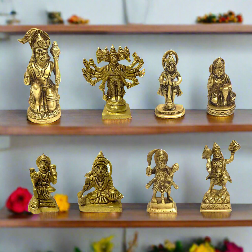 Set of eight brass神像 statues on a white background