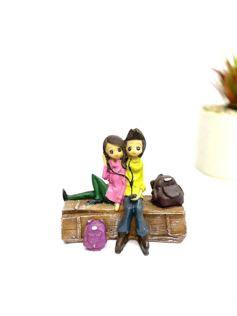 Young Couple Figure Sitting On Several Objects Gifting's Décor tarmapatra