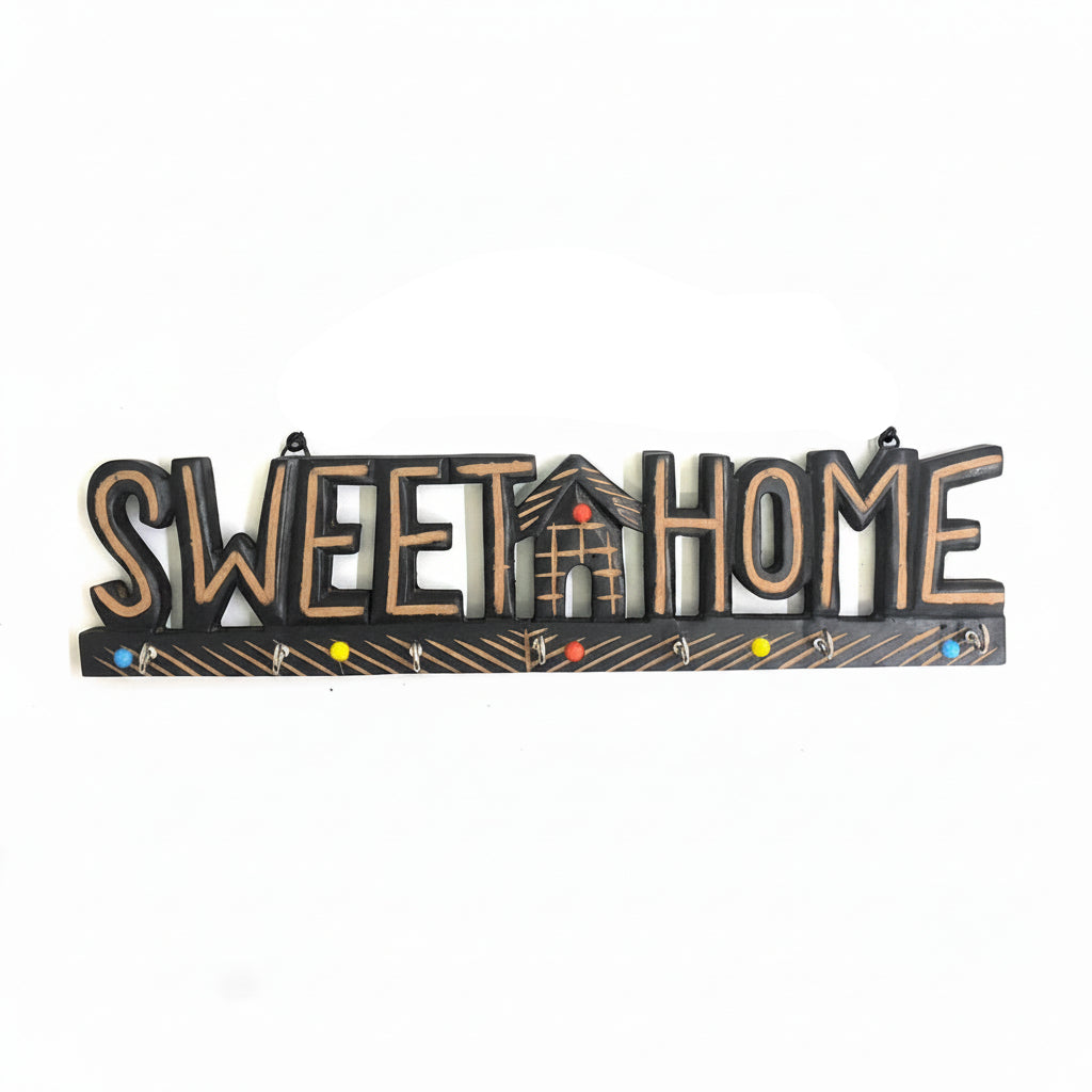 Decorative sign with 'Sweet Home' text on a white background