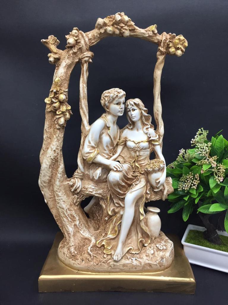 Couple Sitting On Swing Tree Statue Of Love Masterpiece Ivory Shade Tamrapatra