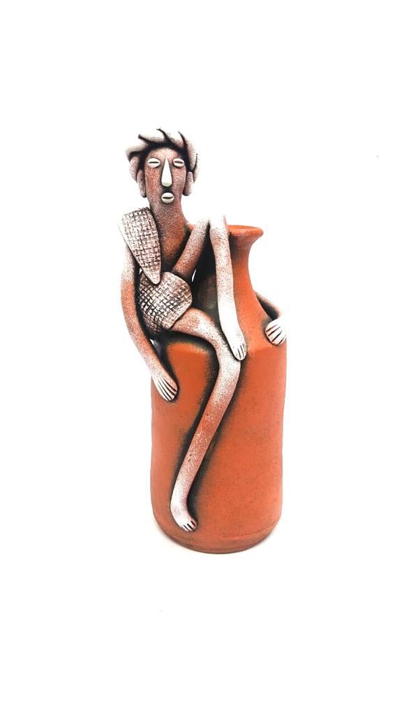 Tribal Man Sitting on Colorful Pot Exclusive Pottery Decoration By Tamrapatra - Tamrapatra