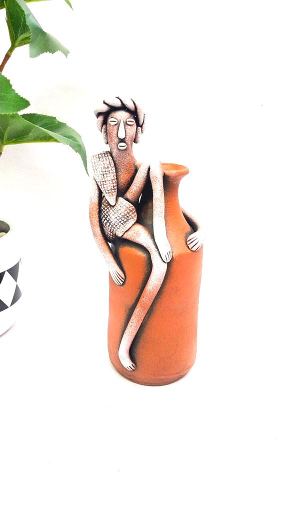Tribal Man Sitting on Colorful Pot Exclusive Pottery Decoration By Tamrapatra - Tamrapatra