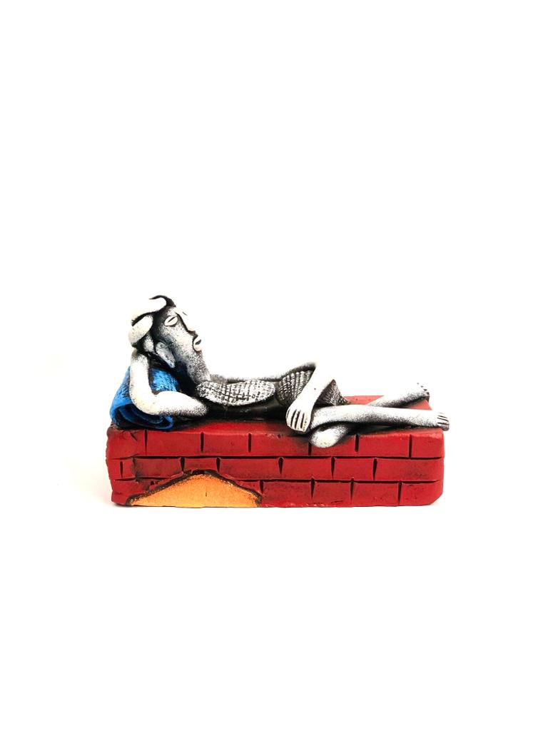Man Taking Rest On Brick Wall Unique Pottery Presented By Tamrapatra - Tamrapatra