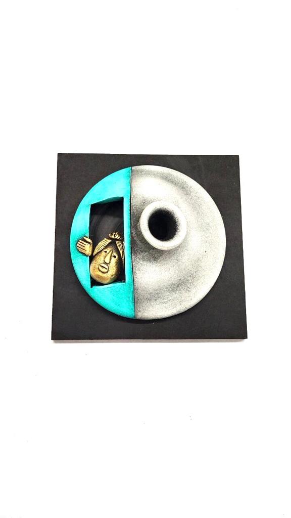 Grey With Turquoise Blue Texture On Creative Peeking Faces Hanging Tamrapatra